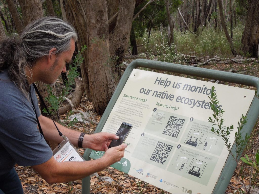Scanning a QR code on a nature trial